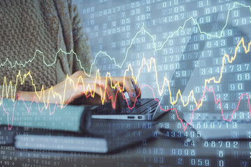 Double exposure of woman hands typing on computer and forex chart hologram drawing. Stock market...