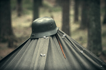 Military helmet of the Finnish army during the war on the Karelian isthmus, on top of a tent in the...