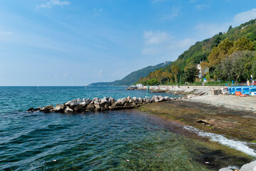 Obraz premium Coast of the Gulf of Trieste. Promenade by the sea, Trieste, Italy