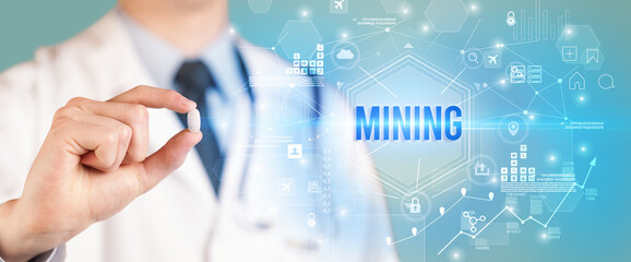 Doctor giving a pill with MINING inscription, new technology solution concept