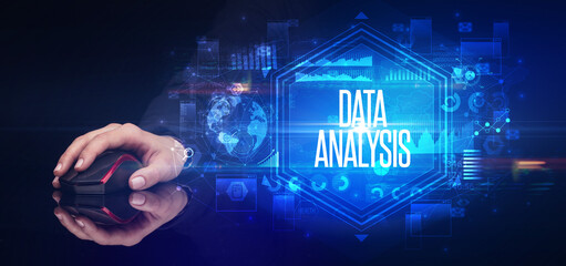 hand holding wireless peripheral with DATA ANALYSIS inscription, cyber security concept