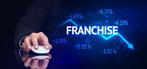 male hand holding wireless peripheral with FRANCHISE inscription, modern business concept