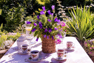 Fototapeta na wymiar still life with tea and flowers