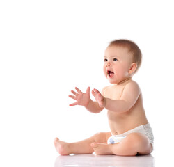 Excited little baby reaches for something portrait