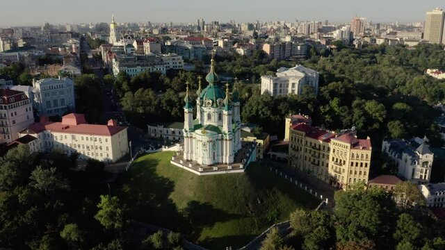 Orthodox Church on green hill in the city Kyiv, Ukraine. Aerial View of St. Andrews Church in the morning