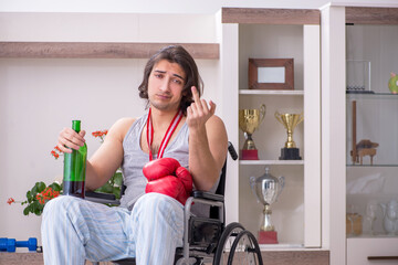 Male ex-champion boxer in wheel-chair suffering from alcoholism