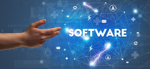 Hand pointing at SOFTWARE inscription, modern technology concept