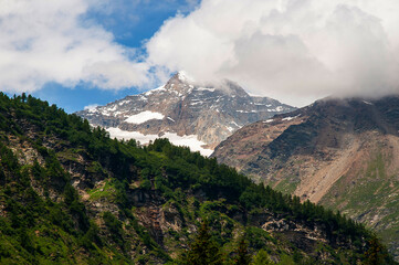 Swiss Mountains and glacier lakes as seen from the Bernini Express Train  from Italy to St Moritz in Switzerland,which is a journey full of wonderful scenery, mountain peaks and deep valleys