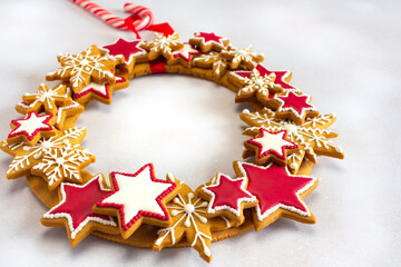 Christmas gingerbread wreath with copy space on white background.