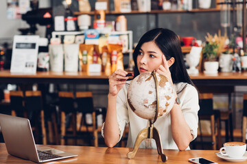 Lifestyle freelance woman he has travel planning after end work in coffee shop