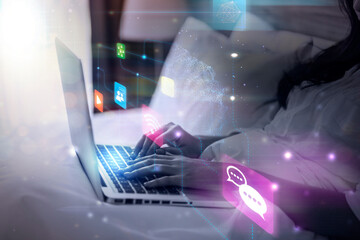 Asian woman in bed using computer laptop applications, media and entertainment social networking connection, wireless internet communication Modern technology futuristic user interface graphics icon
