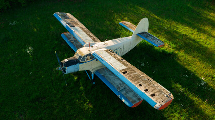 Old abandoned airport with planes. Fuselage, wings and engines. Top view