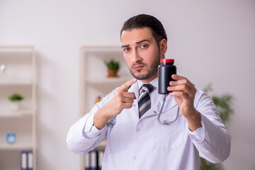 Young male doctor working in the clinic