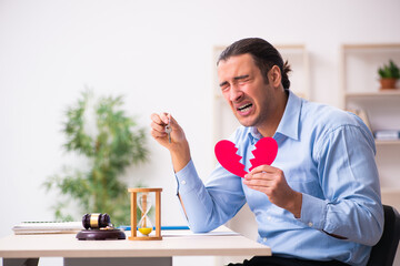 Young man in courthouse in divorcing concept