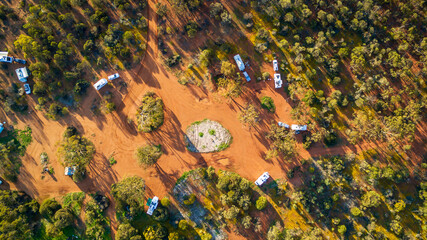Aerial view of 4WD's and caravans camped for the night in the outback of Australia