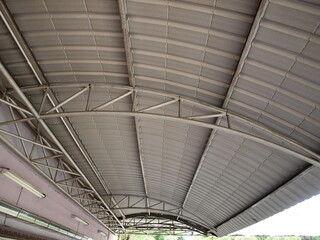 Side building roof structure. Made of steel pipe and metal sheet. Selective focus