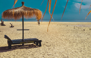 A thatched hut on the beach with beautiful white sand on Gili Labak Beach, Madura, East Java,...