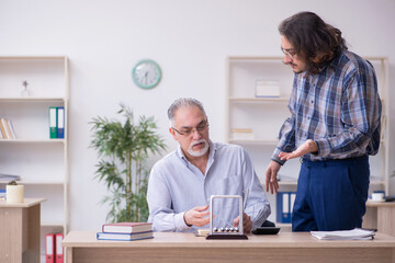 Two employees and meditation balls in the office