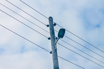 crossed electric pole under the sky