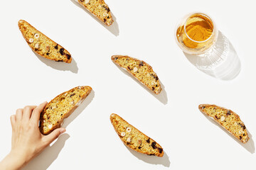 Italian biscotti cookies on baking rack and sweet wine Vin Santo. Fresh baked cookies