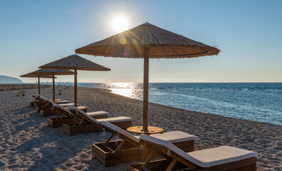 beach chairs and umbrellas on the beach