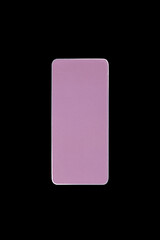 Pink color cosmetic on black background