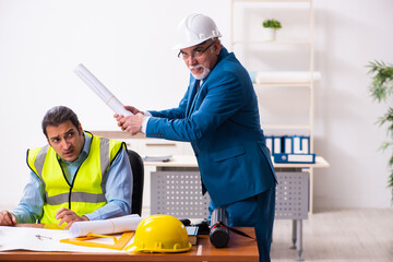 Two male architects working in the office