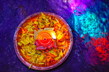 Indian Festival Diwali , lamp and marigold flower petals in pooja thali