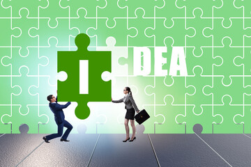 Idea concept with businessman putting jigsaw puzzle