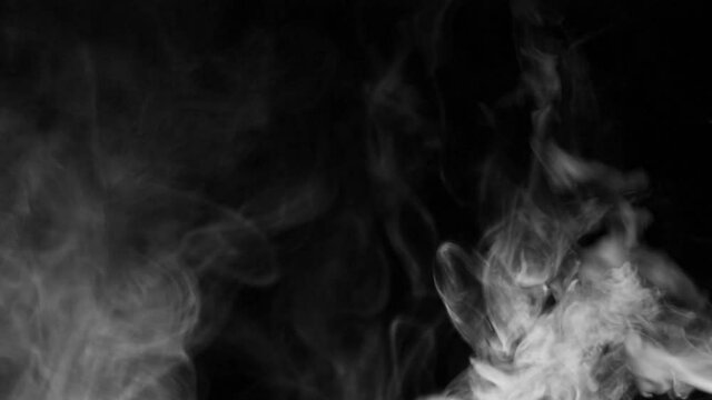 Texture of white smoke on a black background. Slow motion. Vape smoke. cigarette smoke clud.