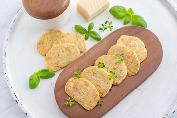 home made cheese crackers with herbs on a table