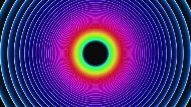 A colorful rainbow tunnel made of neon lights shaped like circles. Loops every 5 seconds.