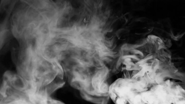 Texture of white smoke on a black background. Slow motion. Vape smoke. cigarette smoke clud.