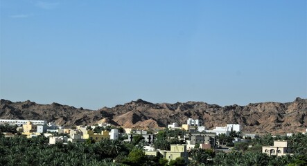 Fototapeta na wymiar Beautiful buildings in the top of the mountain, Muscat, Oman