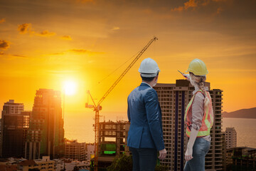 Construction Engineer Builder and Business Man Teamwork Inspection Civil Work at Construction Site, Engineering Inspector Team in Safety Equipment Discuss Constructing Plan for Real Estate Progress