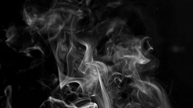 Texture of white smoke on a black background. Slow motion. Vape smoke. cigarette smoke clud.