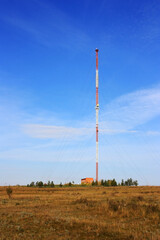Cell tower stands in the field