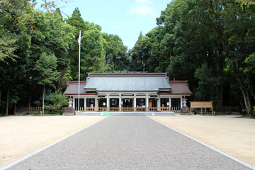 One traditional temple and Japanese flag around Miyazaki Jingu Shrine