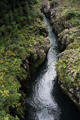 Overlooking rushing river from a bridge at Takachiho Gorge