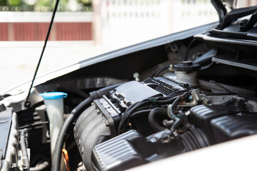 Close-up on the left of the car engine.