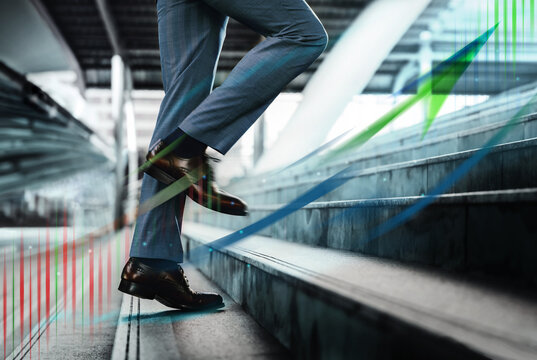 Motion Image. Business Growth, Motivation and Leadership concept. Low Section of Businessman Walking Up on Staircase. Metaphor photo