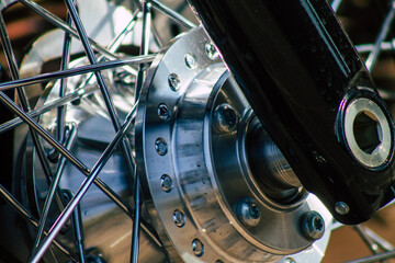Fototapeta na wymiar Closeup of a motorcycle parked in the historical streets of Reims, a city in the Grand Est region of France 