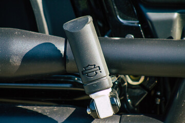 Closeup of a motorcycle parked in the historical streets of Reims, a city in the Grand Est region of France 
