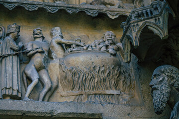 View of the exterior facade of the Roman Catholic Notre Dame de Reims Cathedral, a historical...