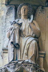 Fototapeta premium View of the exterior facade of the Roman Catholic Notre Dame de Reims Cathedral, a historical monument in the Grand Est region of France and one of the oldest in Europe 