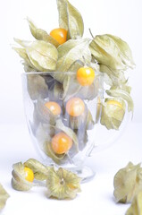 Physalis fruit artistically placed in a glass cup.
Physalis is soft sweet fruit.