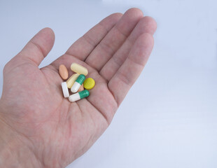 Hand with pills poured into the palm