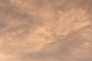Orange-gold moving clouds abstract background image.