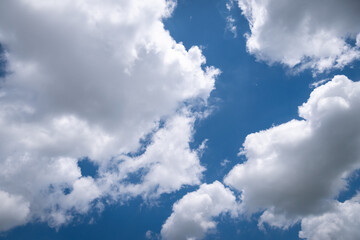 The blue sky with moving white clouds. The most of clouds are beautiful color and shade, suitable for use as background image.