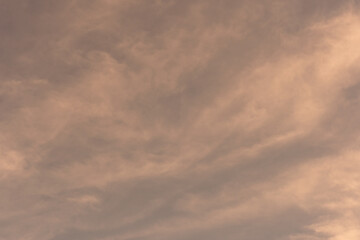 Obraz premium Orange-gold moving clouds abstract background image.